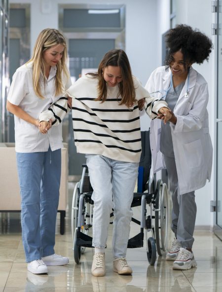 full-shot-female-doctors-helping-patient